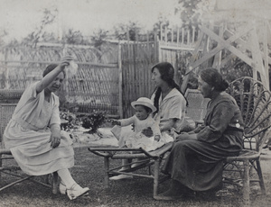 Sarah, Bea, Maggie and Elizabeth Hutchinson sitting in the garden, 35 Tongshan Road, Hongkou, Shanghai