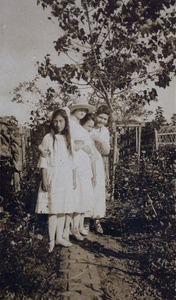 Maggie Hutchinson with Hannah and two unidentified women in the garden, 35 Tongshan Road, Hongkou, Shanghai
