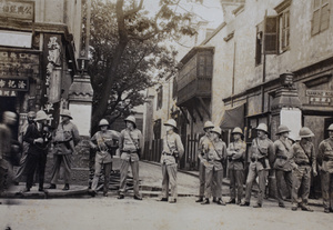 Shanghai Volunteer Corps and Sikh Shanghai Municipal policeman guarding Laozha Police Station, Nanjing Road, Shanghai, 1925