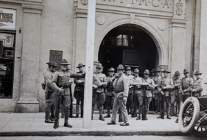 American Company Shanghai Volunteer Corps members outside the entrance to the Navy YMCA, Shanghai, 1925