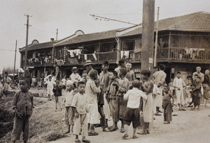 Children and men gathering near the Huasing Road tram sheds, Shanghai, 1925