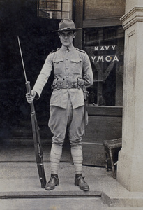 Mr Shagoury, American Company Shanghai Volunteer Corps member, on duty at the entrance to the Navy YMCA, Shanghai, 1925
