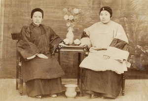 Two Chinese women sitting for a portrait