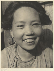 Woman from the ""Lost Tribe"" country wearing earrings