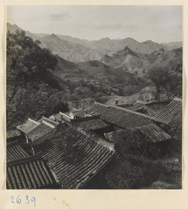 Rooftops in Ta-tsun Village [sic] in Lost Tribe country with mountains in background