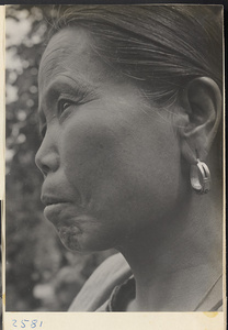 Woman wearing earrings in Tio-liu-po Village [sic]