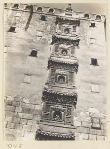 Detail of the south facade of Da hong tai at Pu tuo zong cheng miao showing Buddha niches