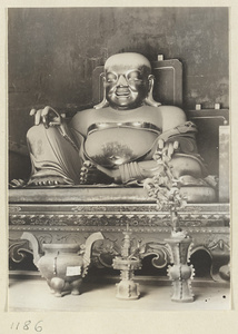 Altar with a Buddha statue at Pu luo si