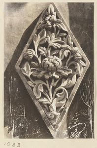 Detail showing diamond-shaped glazed-tile relief panel with floral motif at Xu mi fu shou miao