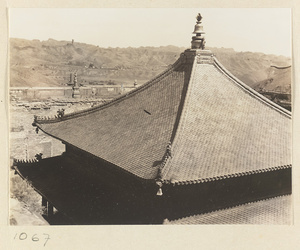 Detail of Wan fa gui yi dian at Pu tuo zong cheng miao showing square double-eaved pyramidal roof with ornaments and bells