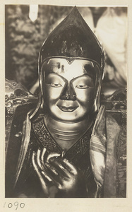 Detail showing head and hands of a statue of a Lama in Miao gao zhuang yan dian at Xu mi fu shou zhi miao