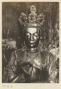 Detail showing head and hand of a statue of a Bodhisattva in Wan fa gui yi dian at Pu tuo zong cheng miao