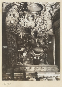 Altar in Miao gao zhuang yan dian at Xu mi fu shou zhi miao showing Buddhist figure on a lotus throne embracing his consort