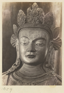 Detail showing the head of a statue of a Bodhisattva