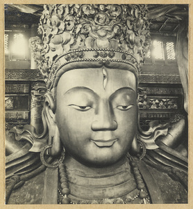 Detail showing head with third eye of statue of Avalokitesvara in Da cheng ge at Da Fo si