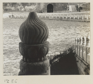 Detail showing marble balaster with a lotus finial at Tai he men and north facade of Wu men