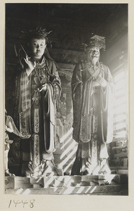Two shrine figures, one holding a stalk of grain, one wearing a mian liu hat, at Da Fo si