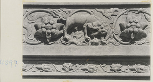 Detail of marble relief carving showing lion and lotus flowers at Yuquan Hill