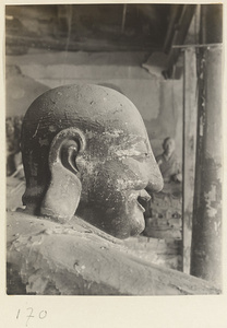 Detail showing the head of a Buddha statue at Tian ning si