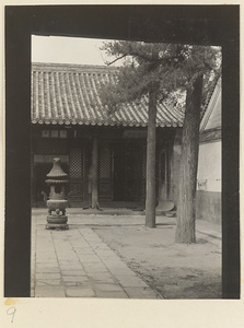 Detail of temple building and courtyard with incense burner at Xi yu si