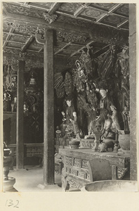 Temple interior at Bi yun si showing altars with statues of Bodhisattvas seated on animals