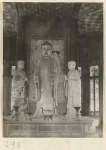 Pavilion interior at Zhuan lun cang showing altar with statues of Buddha and attendants