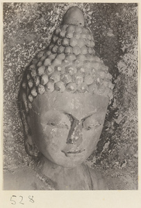 Detail of relief figure of Buddha showing head at Yuquan Hill