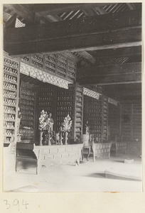 Temple interior showing niches with ritual objects and walls with Bodhisattva reliefs at Wan shou si