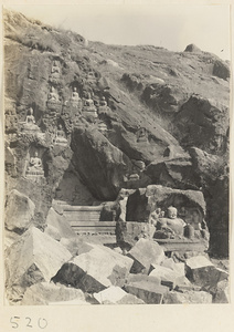 Buddha reliefs cut into the hillside at Yuquan Hill