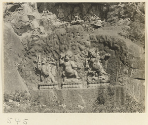 Buddhist relief figures carved into the hillside at Yuquan Hill