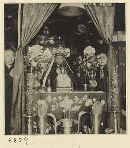 Buddhist nuns behind altar during service