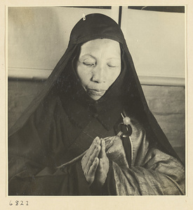 Buddhist nun praying