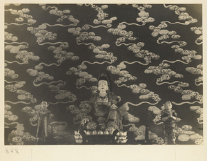 Interior of Wan shan dian showing statues of Bodhisattva and attendants and wall with cloud motif