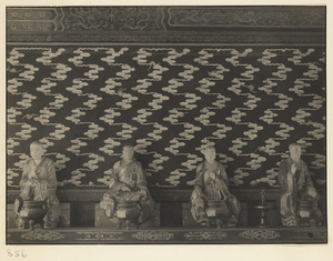 Interior of Wan shan dian showing statues of Luohans and wall with cloud motif