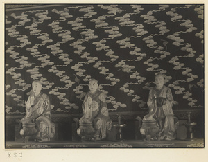 Interior of Wan shan dian showing statues of Luohans and wall with cloud motif