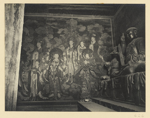 Corner of Da xiong bao dian showing statues of Luohans and right half of Ming dynasty mural of Bodhisattvas and attendants
