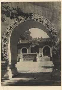 View through an archway showing a gate at Beihai Gong Yuan