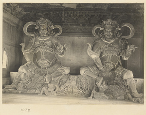 Interior of temple building at Beihai Gong Yuan showing two of the four celestial kings