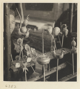 Display of blown candy forms on vendor's stand