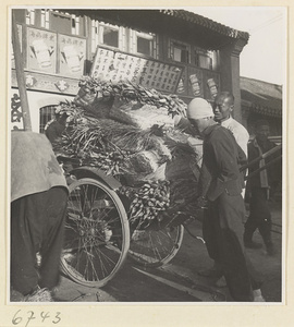 Man with a rickshaw loaded with vegetables
