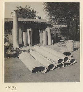 Rolls of finished mats at a mat-making shop