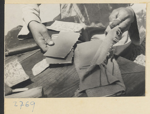 Paper-cut maker preparing to make paper-cuts