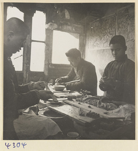 Men at work in a brush-making shop