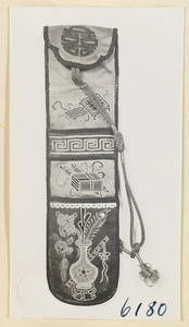 Pipe bag embroidered with a character, books and scrolls, a vase with a ling zhi fungus and a peacock feather, and flutes