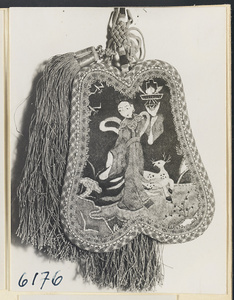 Fan-shaped bag with a tassel, endless mystic knot, and embroidered scene with female figure and deer