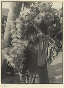 Hawker selling feather dusters