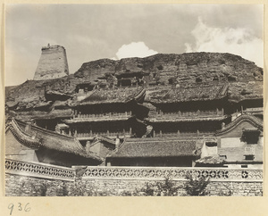 General view of adobe tower and temple buildings at the east end of the Yun'gang Caves
