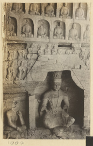 Detail of Cave 30 at Yun'gang showing a niche with a seated Bodhisattva and wall with thousand Buddha relief