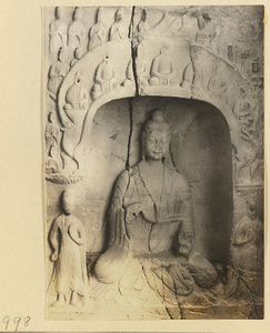 Interior detail of a cave temple at Yun'gang showing a niche with a seated Buddha