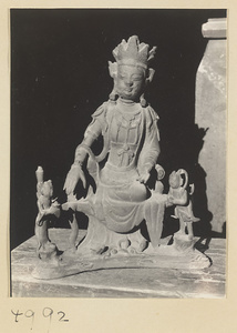 Statue of a seated figure with attendants in a Daoist temple on Hua Mountain